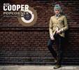 Portada de Álex Cooper - Popcorner - 30 años viviendo en la era pop (CD + Libro).